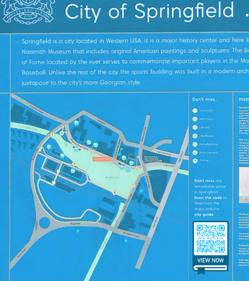 Großes Schild in einer Stadt mit einem QR Code, der einen Stadtführer zum Download im PDF-Format verlinkt.